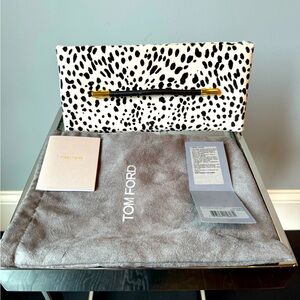 Tom Ford clutch, fur and leather materials